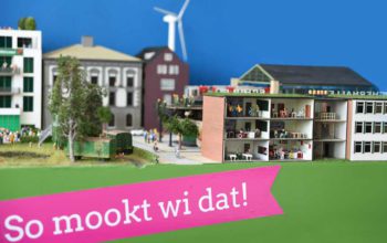 Miniatur Stadtlandschaft mit Erfolgen der GRÜNEN Regierungsbeteiligung